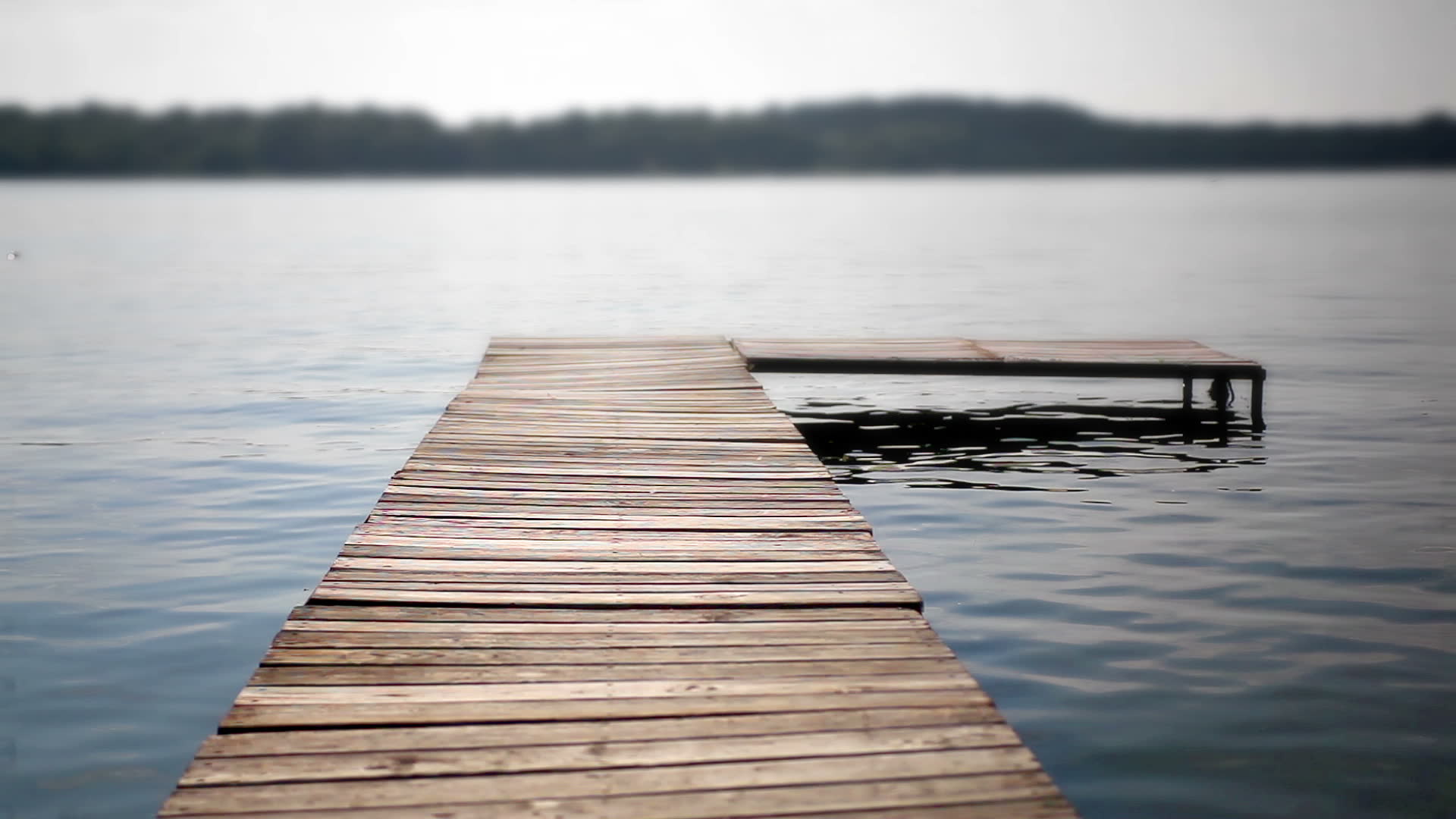 stock-footage-shot-of-a-wooden-dock-exte