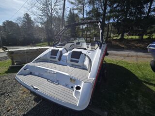 photo showing the back of the boat where you can see the platform and a couple seats