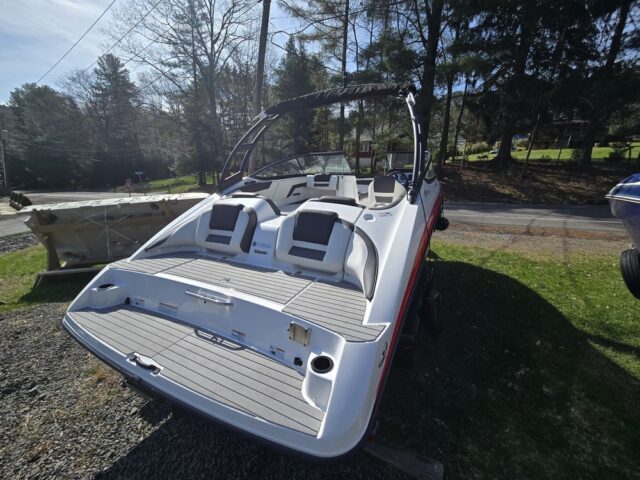 photo showing the back of the boat where you can see the platform and a couple seats