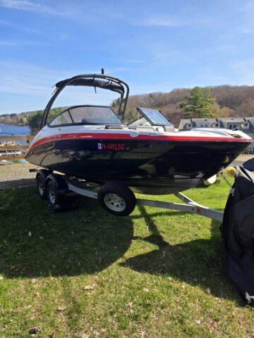 boat on trailer photo, boat is white and black and red